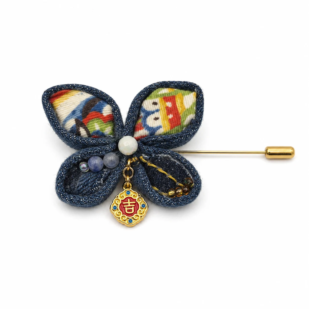 Denim textile brooch with bead and charm details